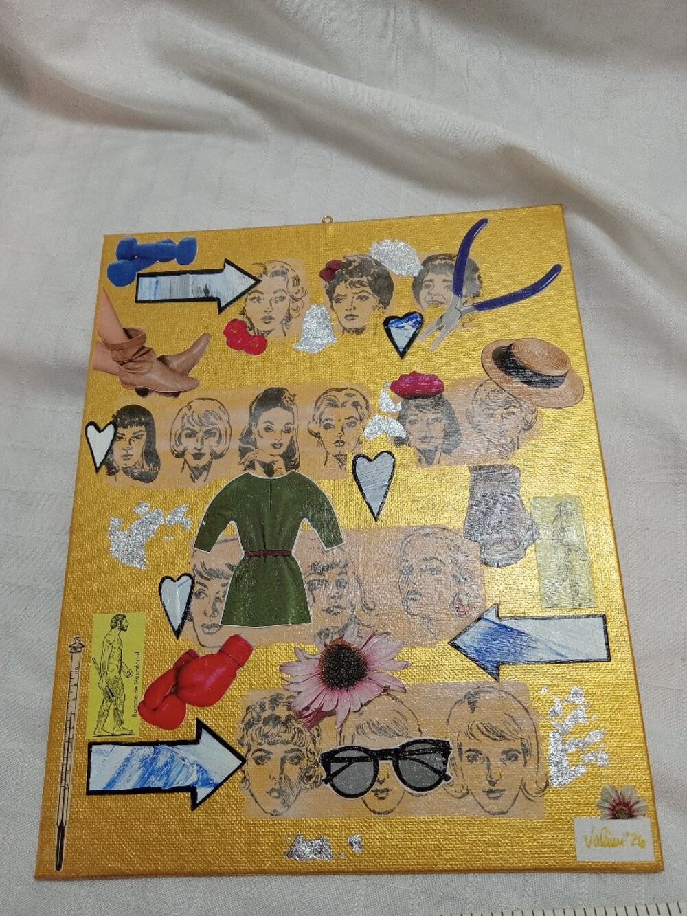 Prints of old magazines on canvas, gold paint, and mixed-media collages